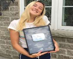 The girl is honored with a silver button by YouTube for gaining a huge fan base.